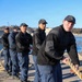 Sailors aboard the USS John Finn conduct a sea and anchor detail in Yokosuka, Japan