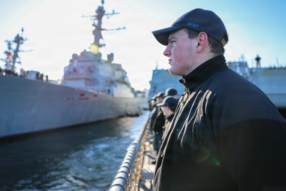 Sailors aboard the USS John Finn conduct a sea and anchor detail in Yokosuka, Japan