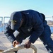 Sailors aboard the USS John Finn conduct a sea and anchor detail in Yokosuka, Japan