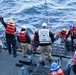 Sailors aboard the USS John Finn conduct a small boat operation in Yokosuka, Japan