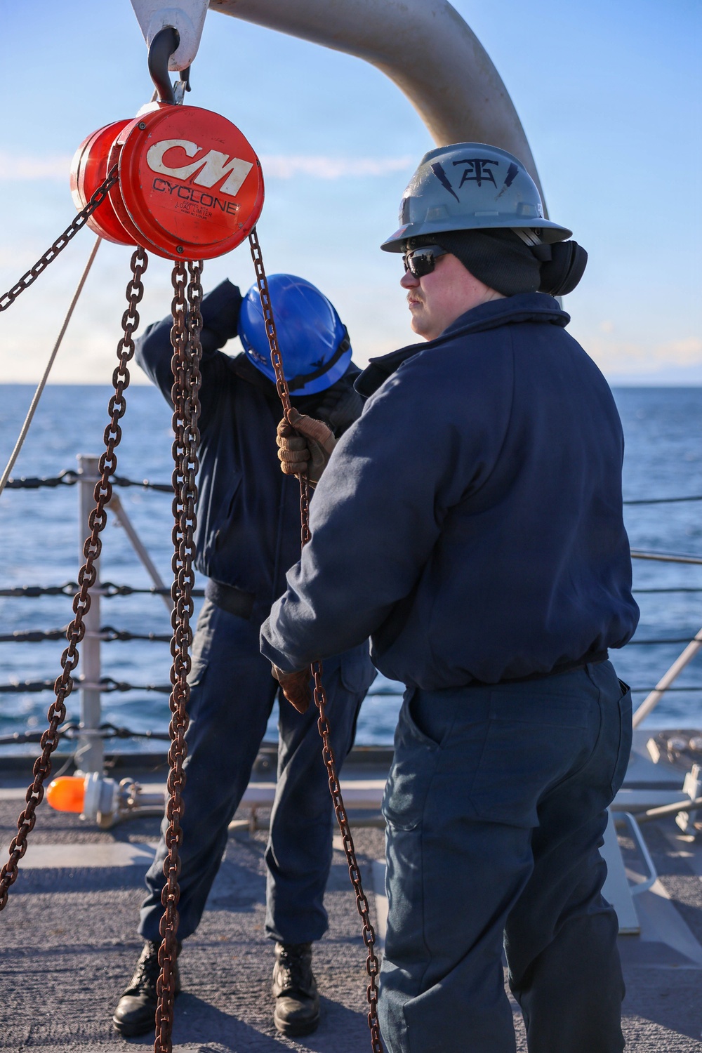 Sailors aboard the USS John Finn conduct a torpedo upload in Yokosuka, Japan