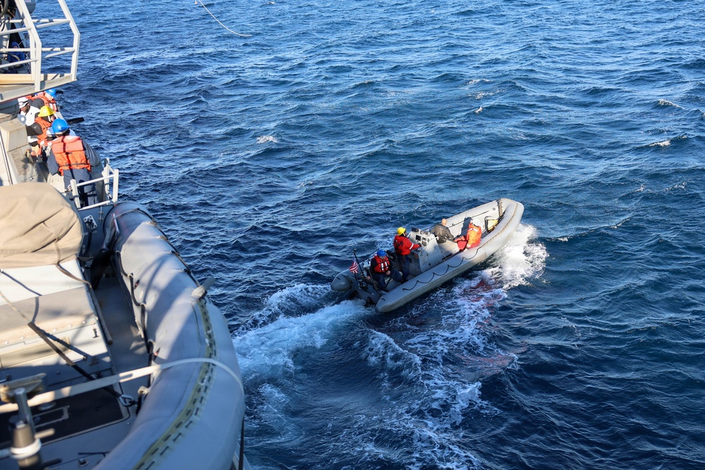 Sailors aboard the USS John Finn conduct a small boat operation in Yokosuka, Japan