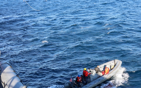 Sailors aboard the USS John Finn conduct a small boat operation in Yokosuka, Japan