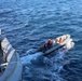 Sailors aboard the USS John Finn conduct a small boat operation in Yokosuka, Japan