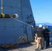 Sailors aboard the USS John Finn conduct a torpedo upload in Yokosuka, Japan