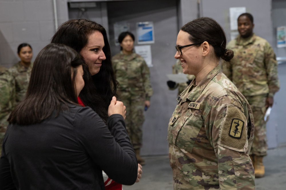 Newly Promoted Captain Administers Oath to Fellow Officer at 30th Medical Brigade Ceremony