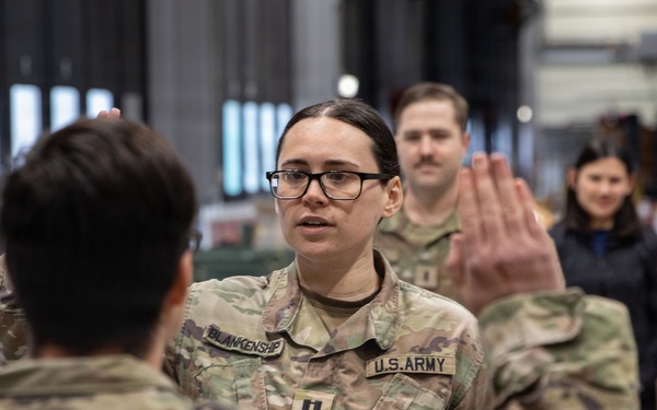 Newly Promoted Captain Administers Oath to Fellow Officer at 30th Medical Brigade Ceremony