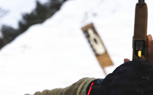 U.S. Army Sgt. Jehiel Jackson Reloads his pistol during a pistol qualification