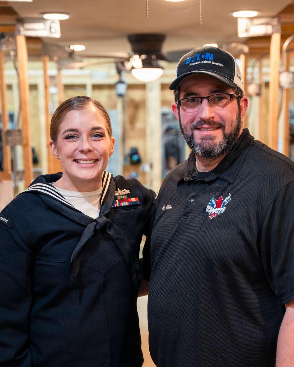 Recruiter speaks to students of school she attended before the Navy