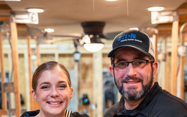 Recruiter speaks to students of school she attended before the Navy