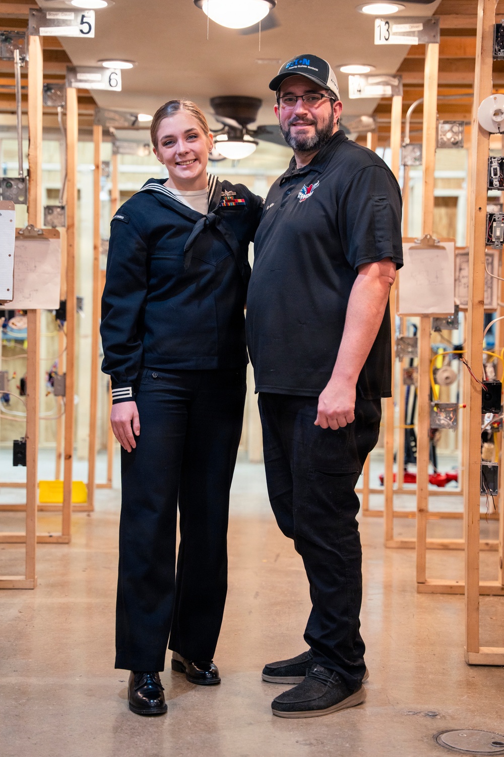 Recruiter speaks to students of school she attended before the Navy