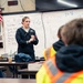 Recruiter speaks to students of school she attended before the Navy