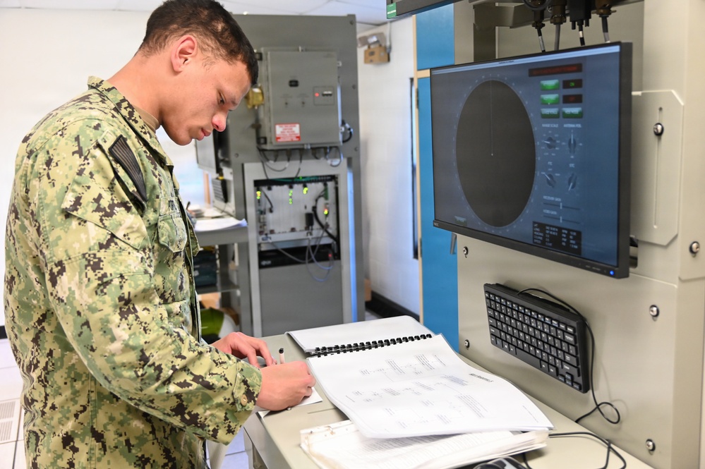 Electronics Technician students troubleshoot the T-1 radar trainer