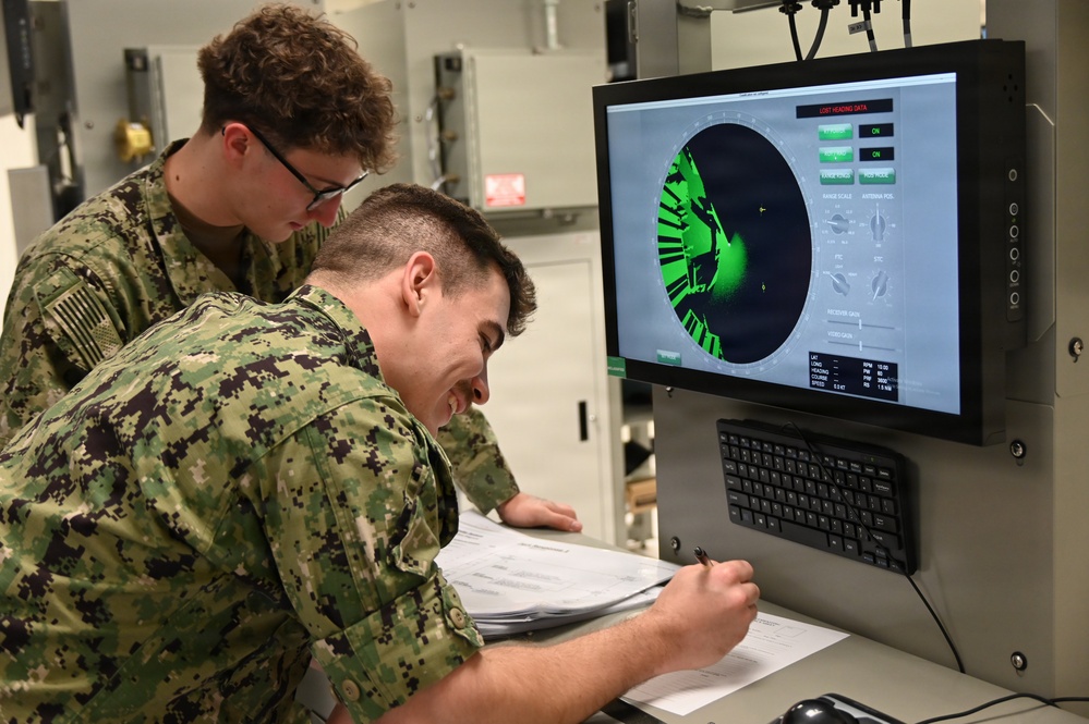 Electronics Technician students troubleshoot the T-1 radar trainer