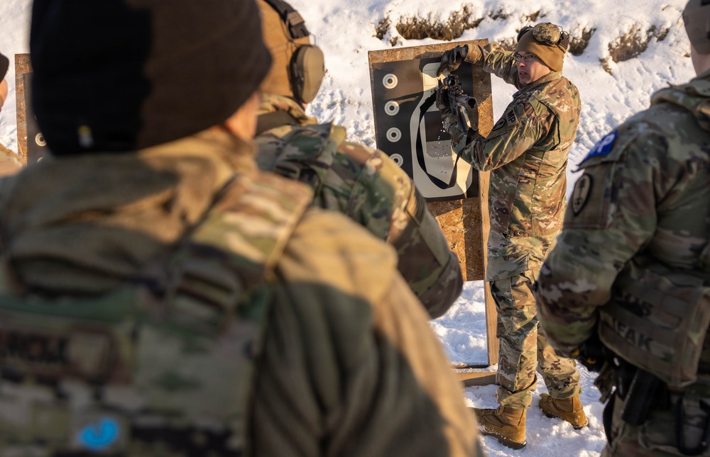 U.S. Army Staff Sgt. Instructs Soldiers During  Law Enforcement Weapons Qualification in Latvia