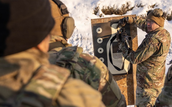 U.S. Army Staff Sgt. Instructs Soldiers During  Law Enforcement Weapons Qualification in Latvia