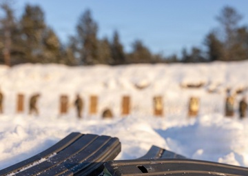 Soldiers Fire in the Snow During Law Enforcement Weapons Training in Latvia