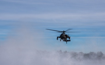 Polish AH-64 Apache land in a swirl of snow at Winter Falcon 26