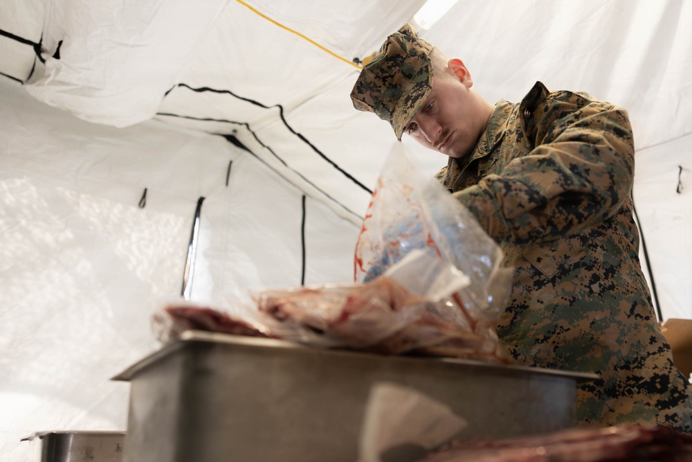 U.S. Marine Corps reservists with MWSS 472 undergo a food inspection for the Major General William Pendleton Thompson Hill Food Service Award