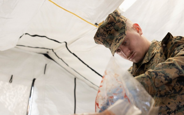 U.S. Marine Corps reservists with MWSS 472 undergo a food inspection for the Major General William Pendleton Thompson Hill Food Service Award