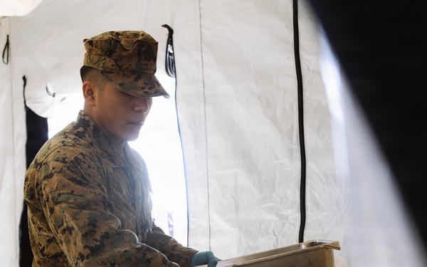 U.S. Marine Corps reservists with MWSS 472 undergo a food inspection for the Major General William Pendleton Thompson Hill Food Service Award