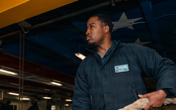 USS Theodore Roosevelt Sailors Heave Mooring Lines