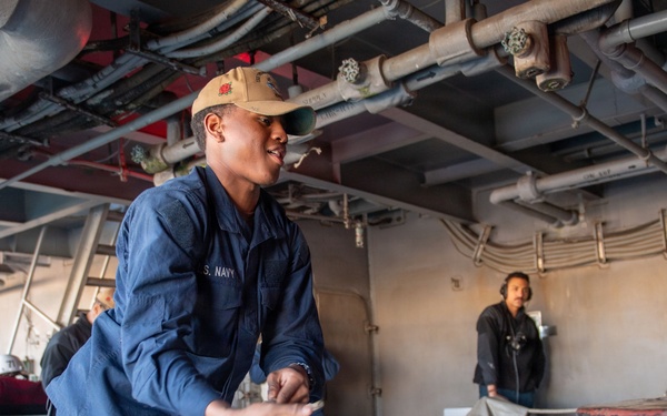 USS Theodore Roosevelt Sailor Heaves Mooring Lines