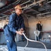 USS Theodore Roosevelt Sailor Heaves Mooring Lines