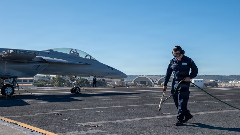 USS Theodore Roosevelt Sailor Cleans Padeyes