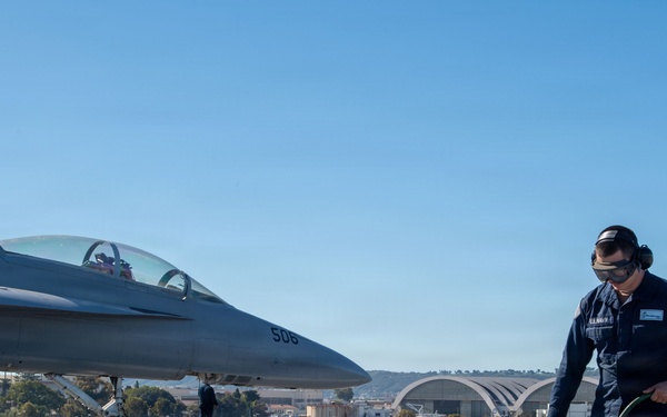 USS Theodore Roosevelt Sailor Cleans Padeyes