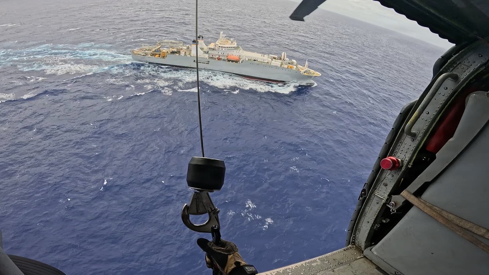 U.S. Navy Helicopter Sea Combat Squadron 25 approaches vessel off Guam for medevac