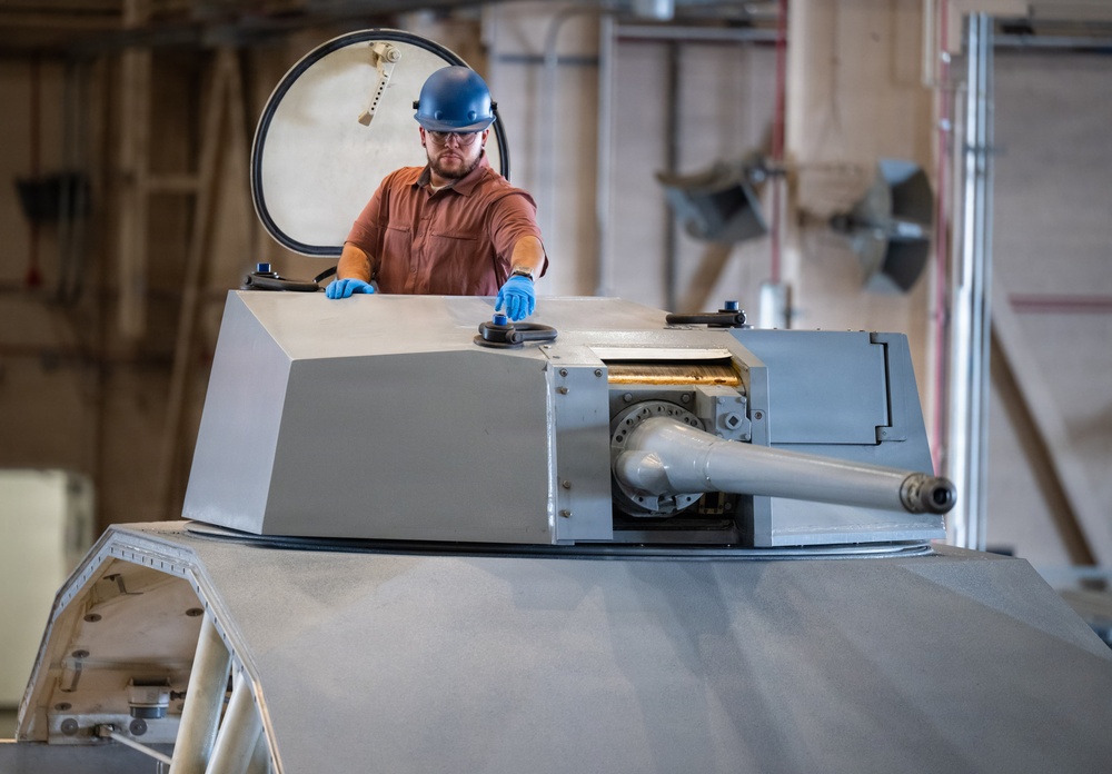 Mission Package Support Facility Team Prepares Gun Mission Module for Shipment to Florida