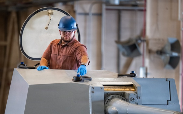 Mission Package Support Facility Team Prepares Gun Mission Module for Shipment to Florida