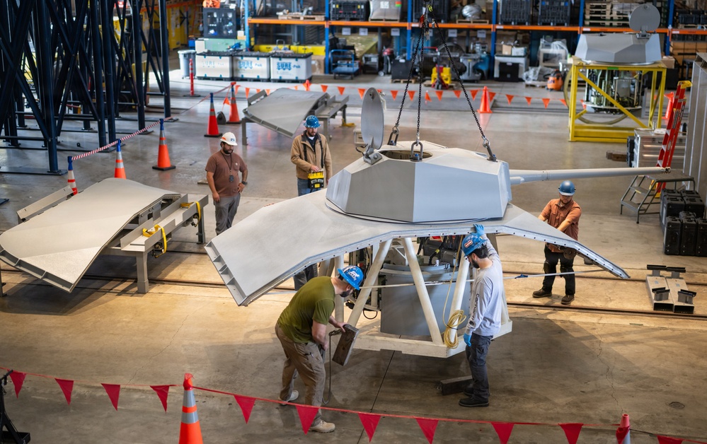 Mission Package Support Facility Team Prepares Gun Mission Module for Shipment to Florida