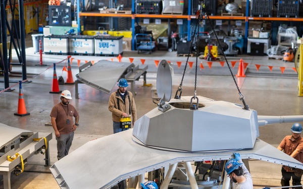 Mission Package Support Facility Team Prepares Gun Mission Module for Shipment to Florida