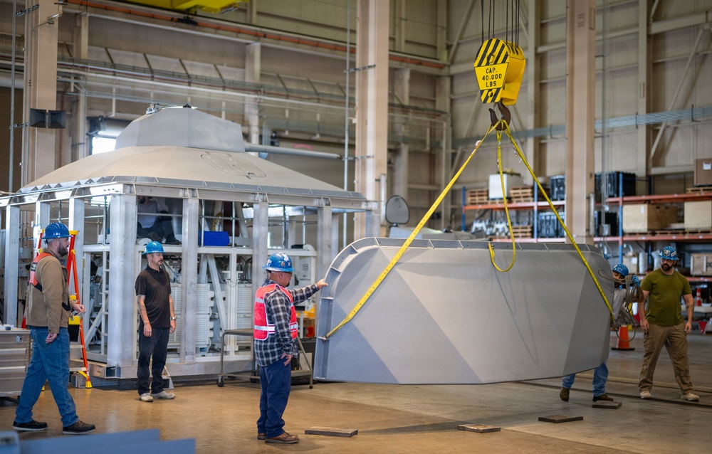 Mission Package Support Facility Team Prepares Gun Mission Module for Shipment to Florida