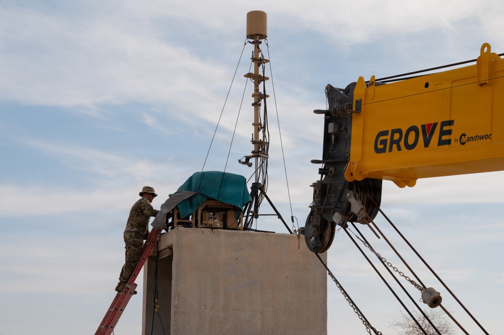 379th Expeditionary Civil Engineering Squadron move a sensor