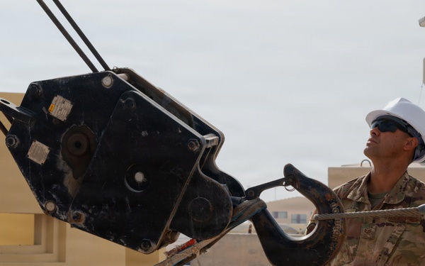 379th Expeditionary Civil Engineering Squadron move a sensor