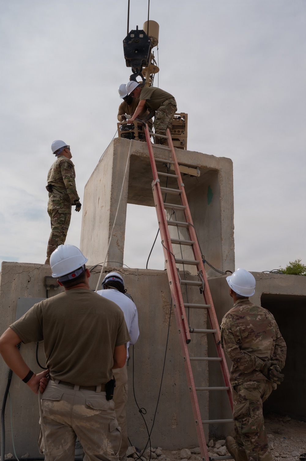 379th Expeditionary Civil Engineering Squadron move a sensor