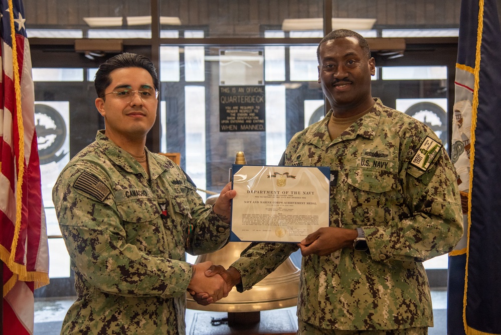 Engineman 1st Class Camacho receives Navy and Marine Corps Achievement Medal at end of SWESC tour