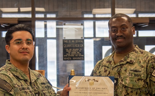 Engineman 1st Class Camacho receives Navy and Marine Corps Achievement Medal at end of SWESC tour