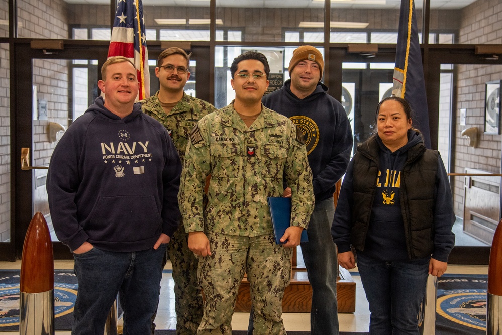 Engineman 1st Class Camacho receives Navy and Marine Corps Achievement Medal at end of SWESC tour