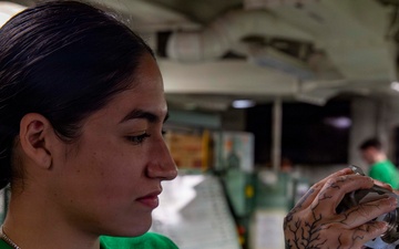 Abraham Lincoln conducts routine aircraft maintenance