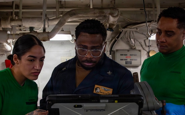 Abraham Lincoln conducts routine aircraft maintenance