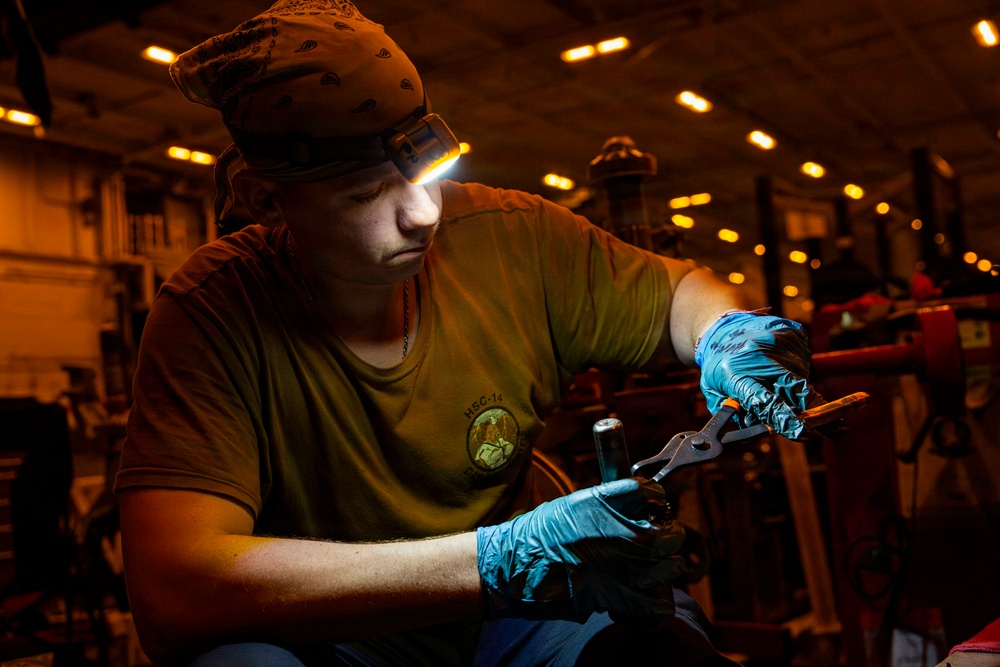 Abraham Lincoln conducts routine aircraft maintenance