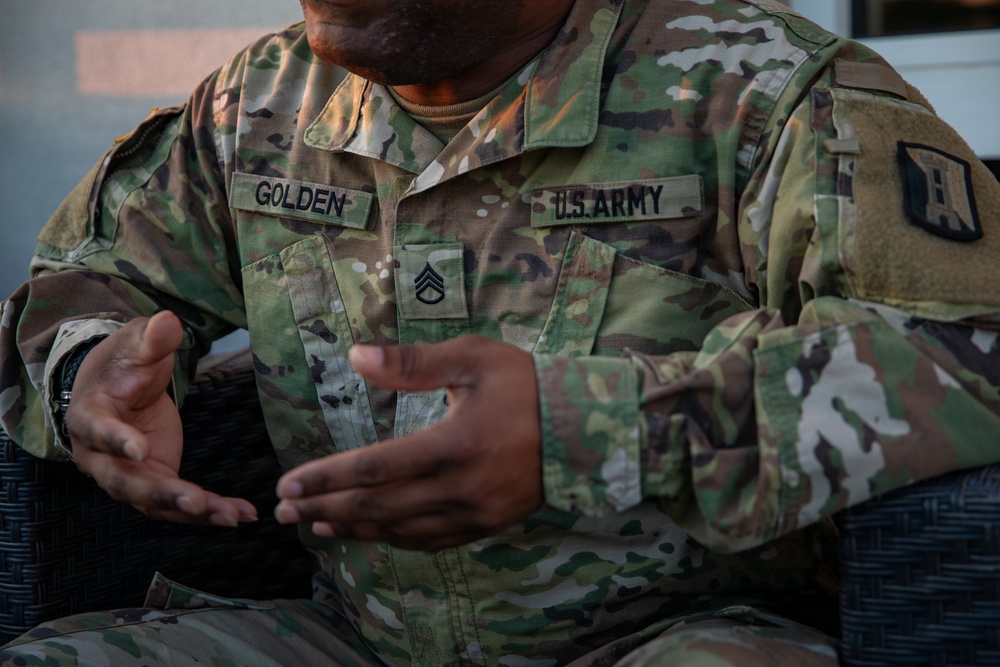 A Mississippi Army National Guard Soldier participates in a father-son interview