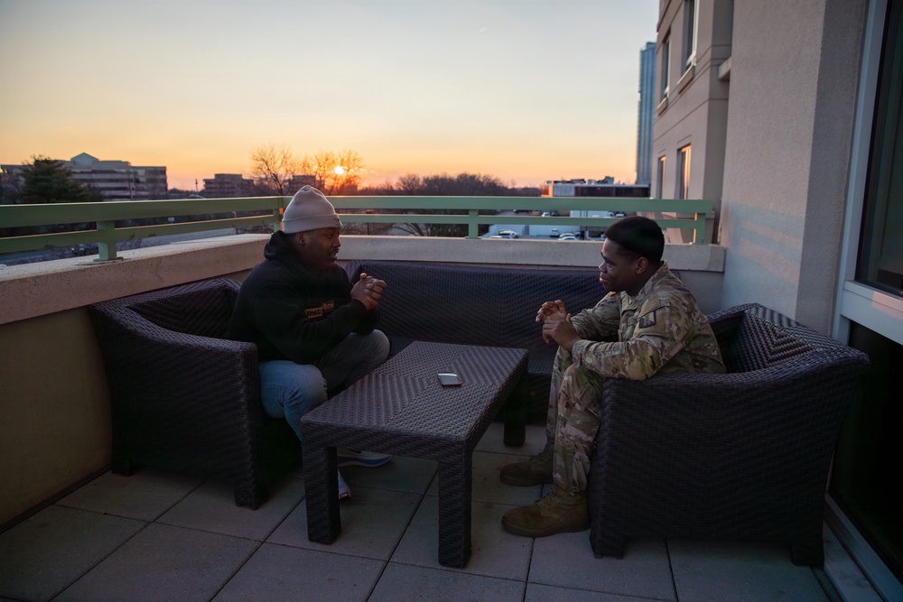 A Mississippi Army National Guard Soldier participates in a father-son interview