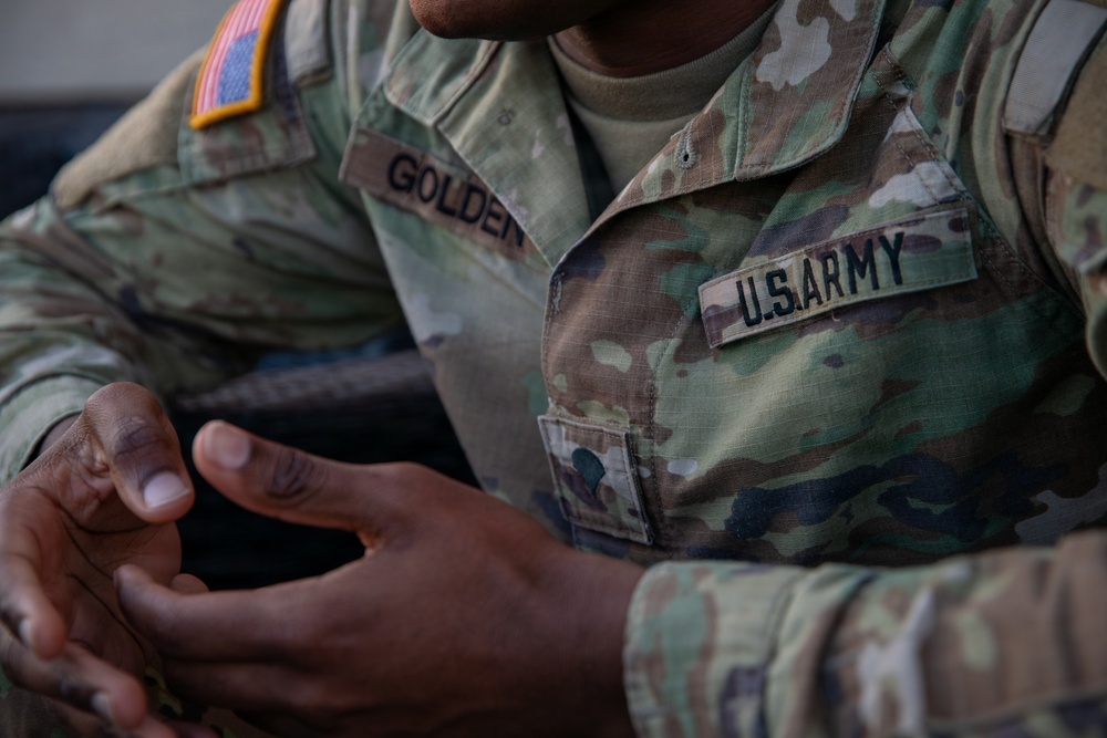 A Mississippi Army National Guard Soldier participates in a father-son interview