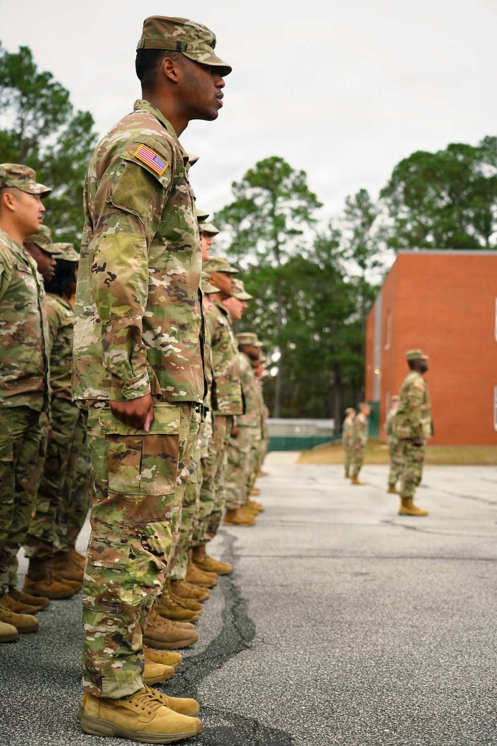 U.S. Army Soldiers and Army National Guardsmen stand at attention during Change of Responsibility Ceremony