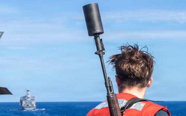 Abraham Lincoln conducts a replenishment-at-sea with Yukon